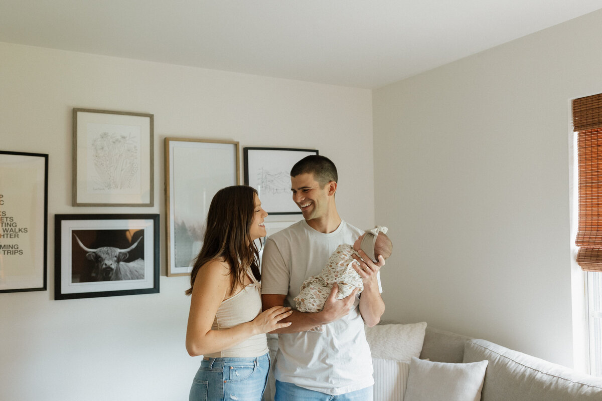 Indianapolis family photography parents with newborn baby