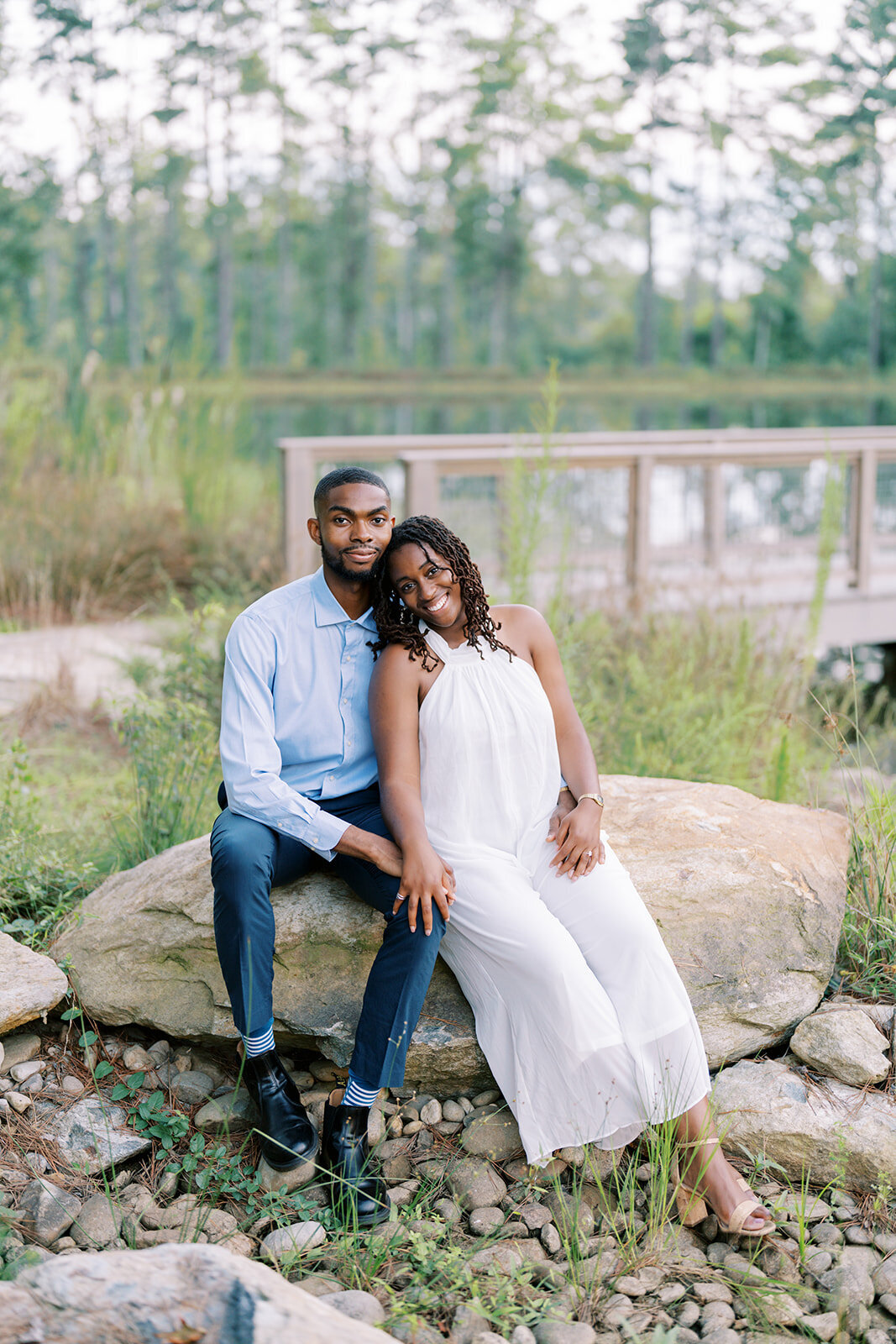 Agnes and Uzo share an elegant, snuggly spring engagement session by the water at The Barn at Union Grove Farm. With Chapel Hill roots and a long-distance relationship, they reunited in town for the first time in months just for this session, captured by North Carolina wedding photographer Jessica Leigh Mason.