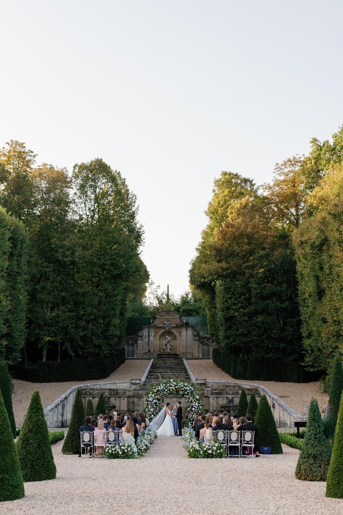 wedding ceremony with bride, groom and guests