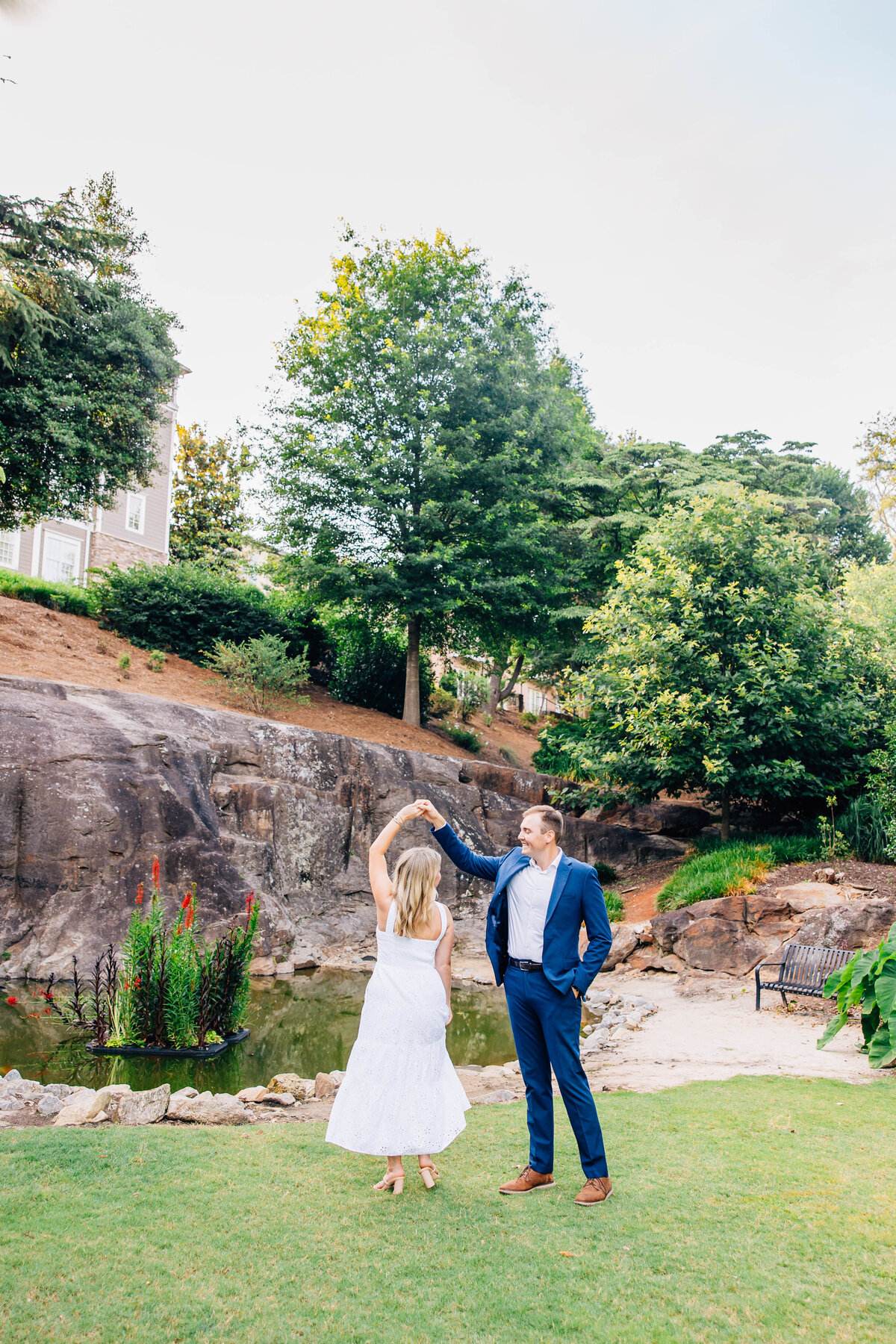 couple dancing at engagement session in greenville south carolina at the rock quarry