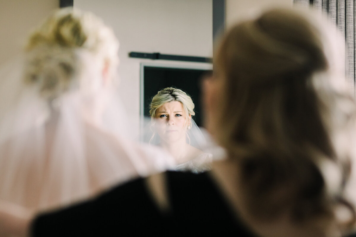 A creatively captured moment of a bride getting ready on her wedding day