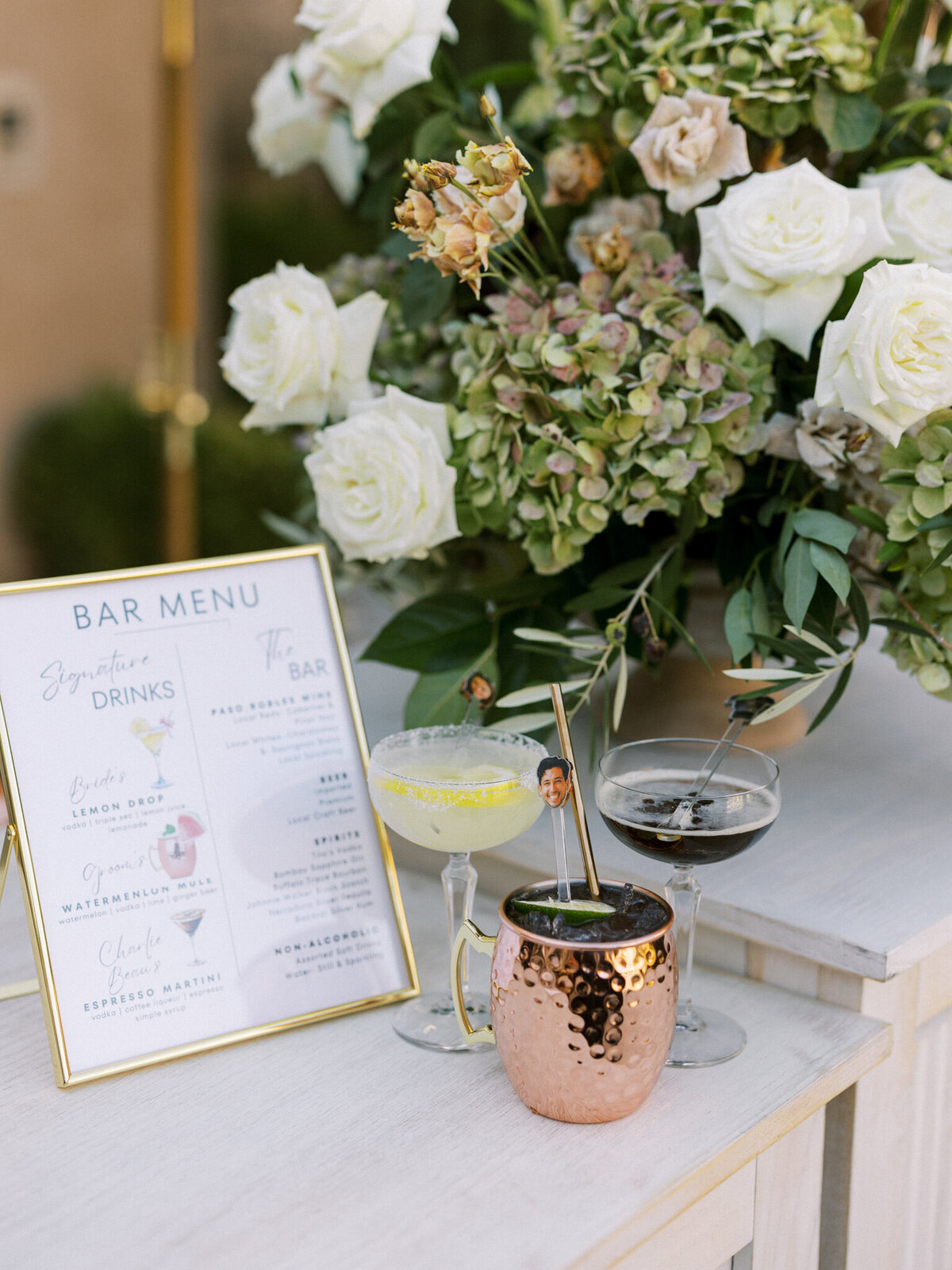 Chic signature cocktail display with fresh florals at Allegretto Vineyard—elegant, inviting, and full of personality.