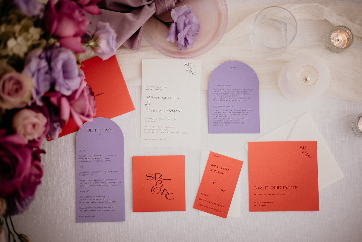 Orange and lavender bright wedding invitation suite with arched cards