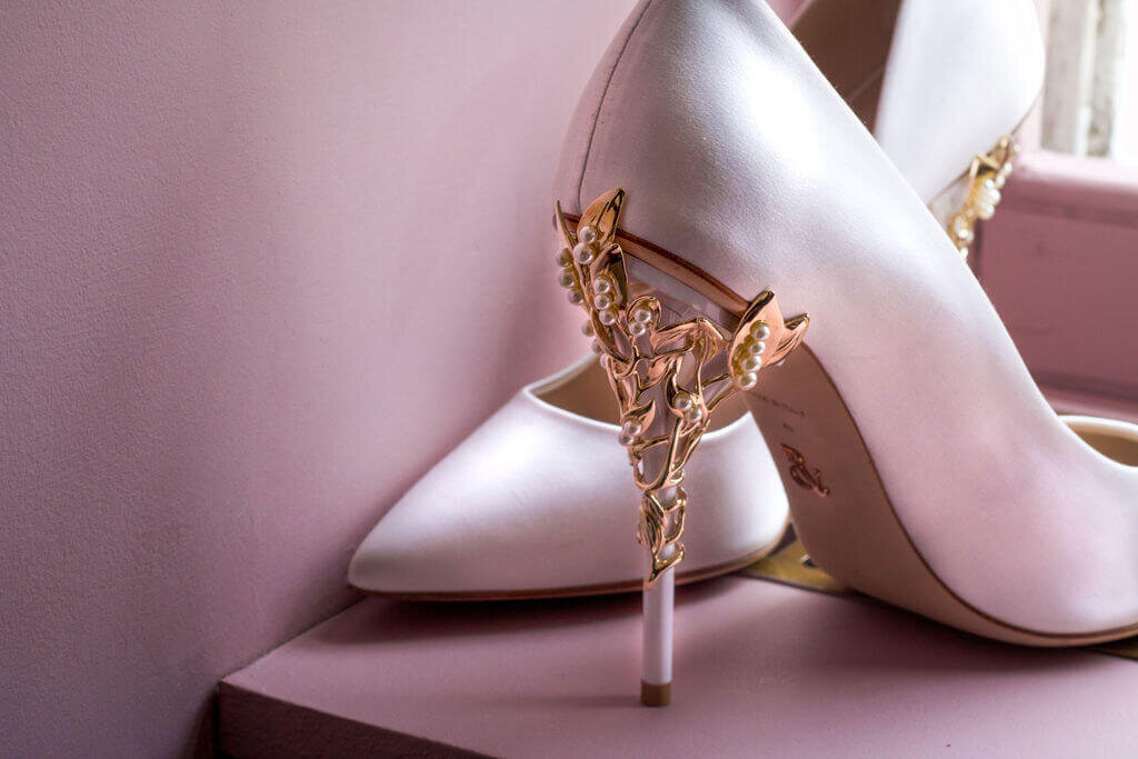White satin stilettoes with gold plated heel