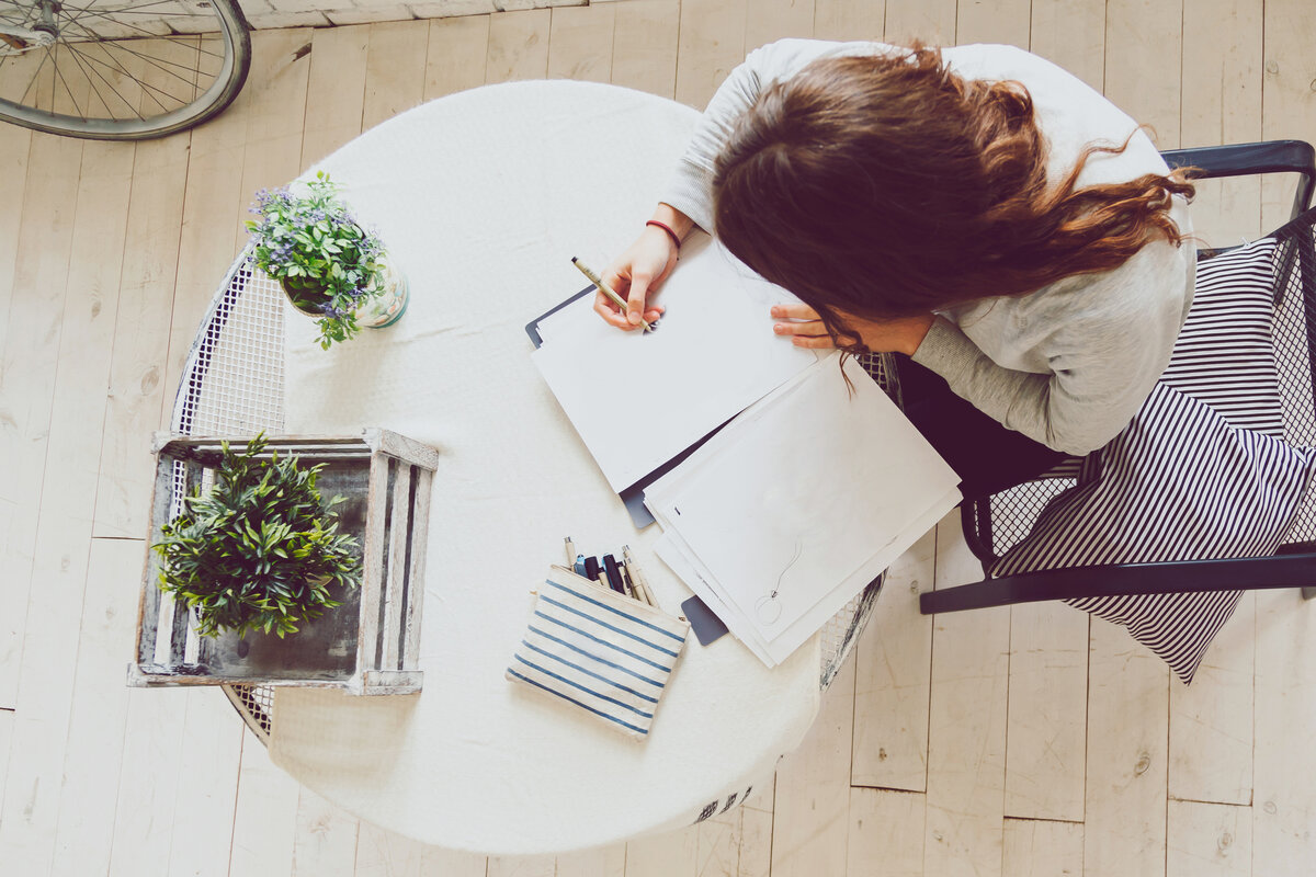 female-drawing-sketch-on-desk-with-designing-equip-PAZLPFS