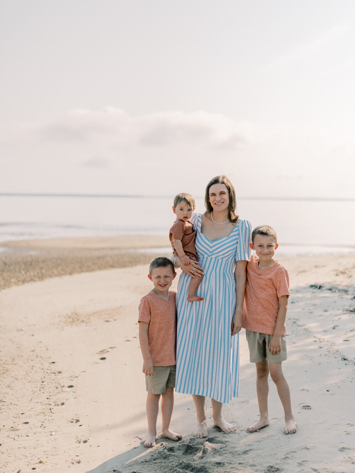 Mom posing with her sons.