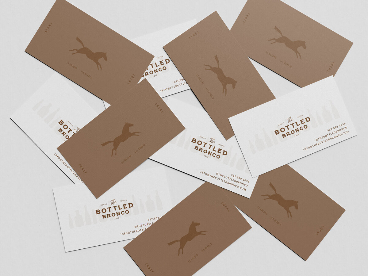 Business card mockup with modern rustic bronco icon.