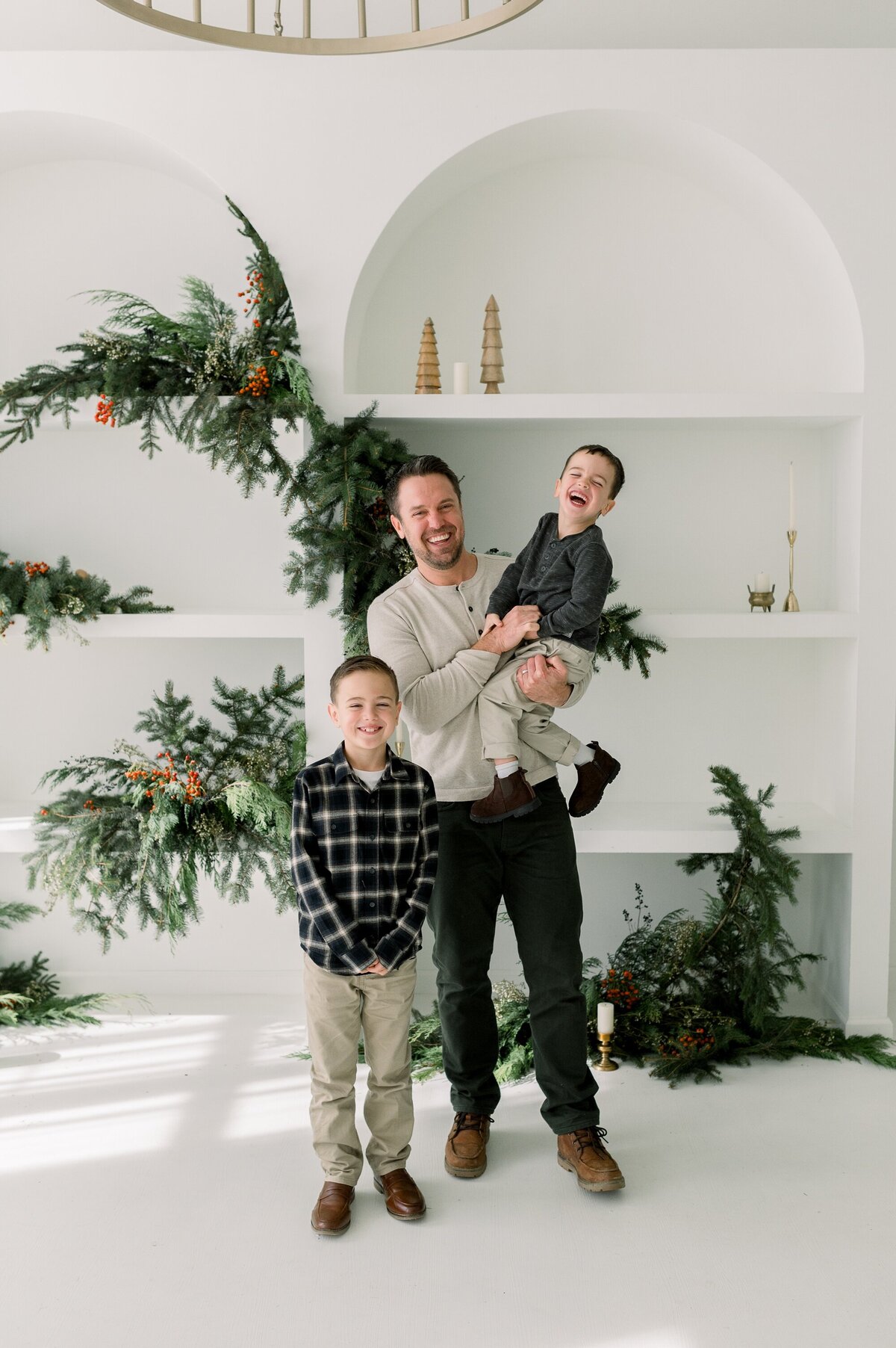 Dad and sons laughing.