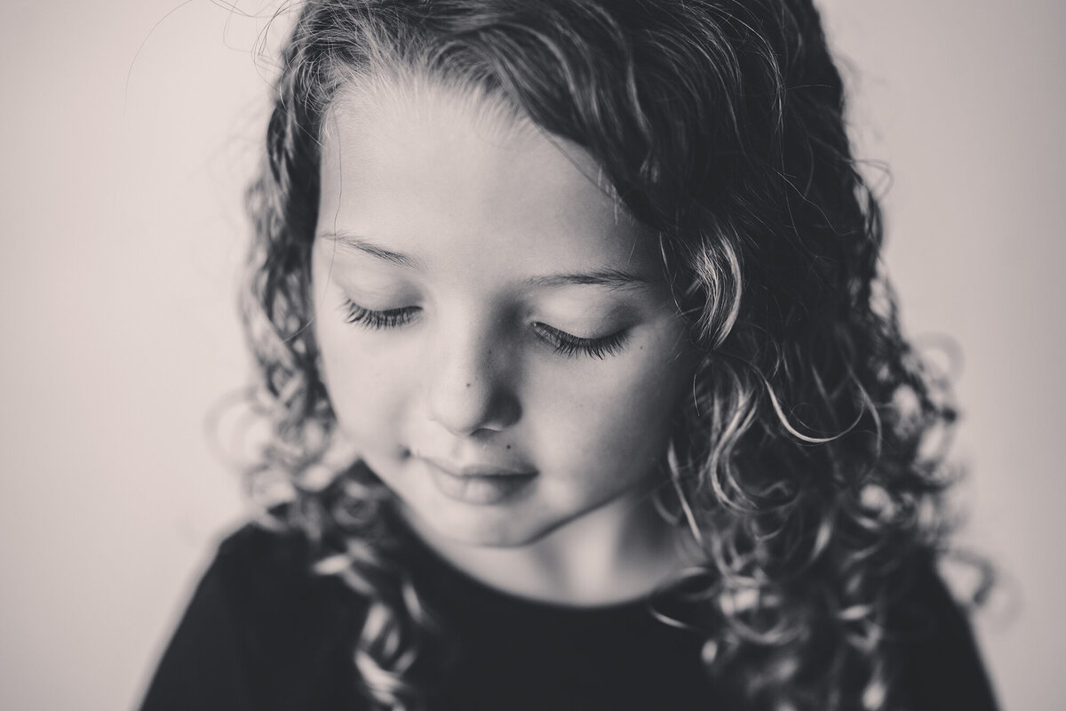 Young girl looks away from the camera during Personality Portrait Session in Charleston, SC. 