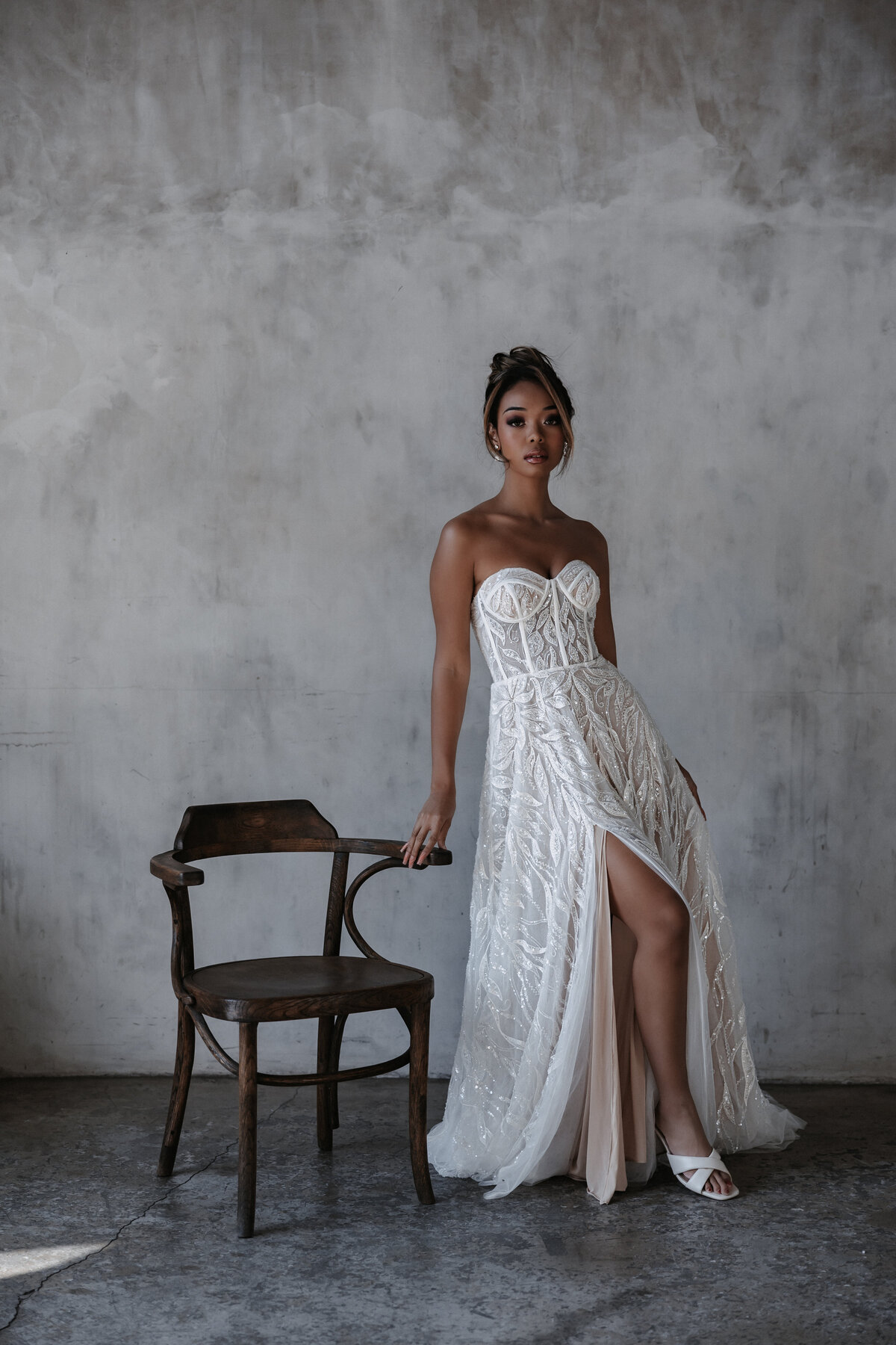 Bridal portrait in front of concrete wall