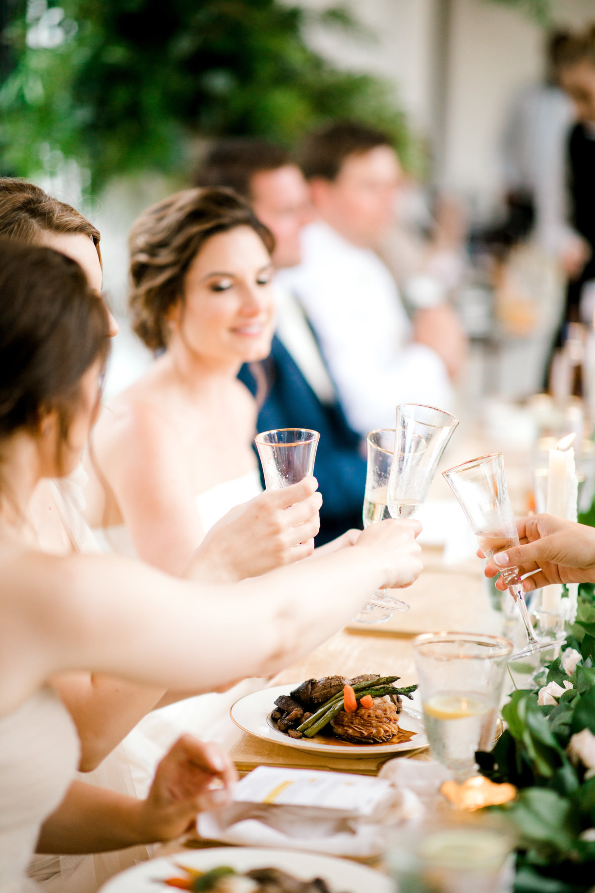 Wedding reception guest toasting