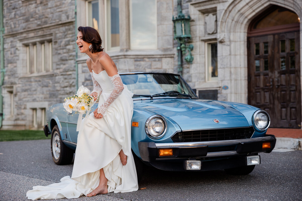 A bride laughing at Branford House.