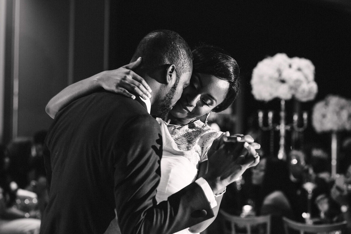 Close-up portrait of a bride and groom sharing an emotional and romantic moment during their first dance