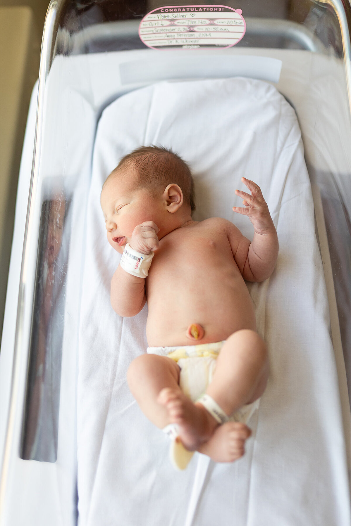 Fresh 48 image of newborn in the hospital bassinet.