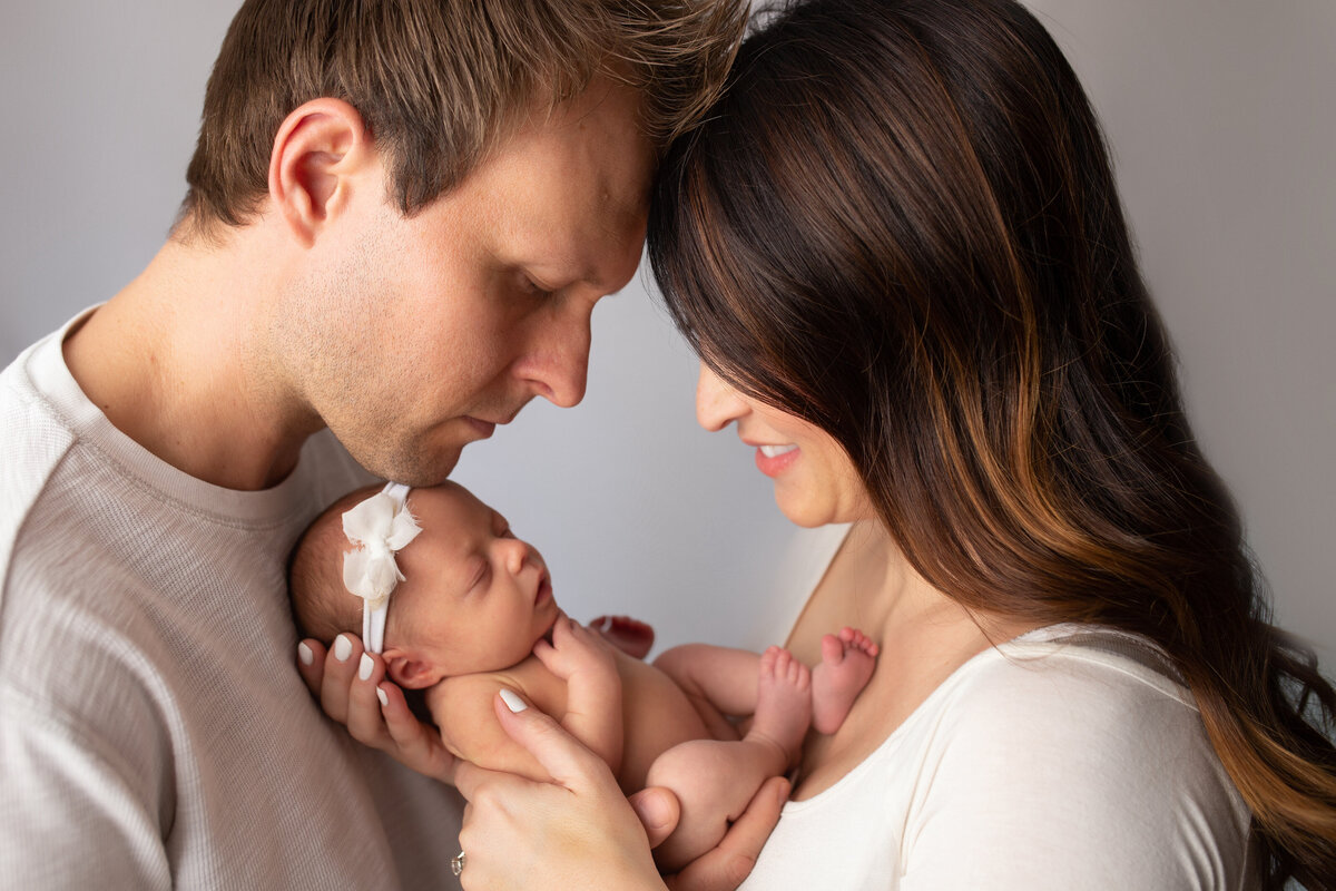 Santa Clarita Newborn studio Photography with parents holding new baby