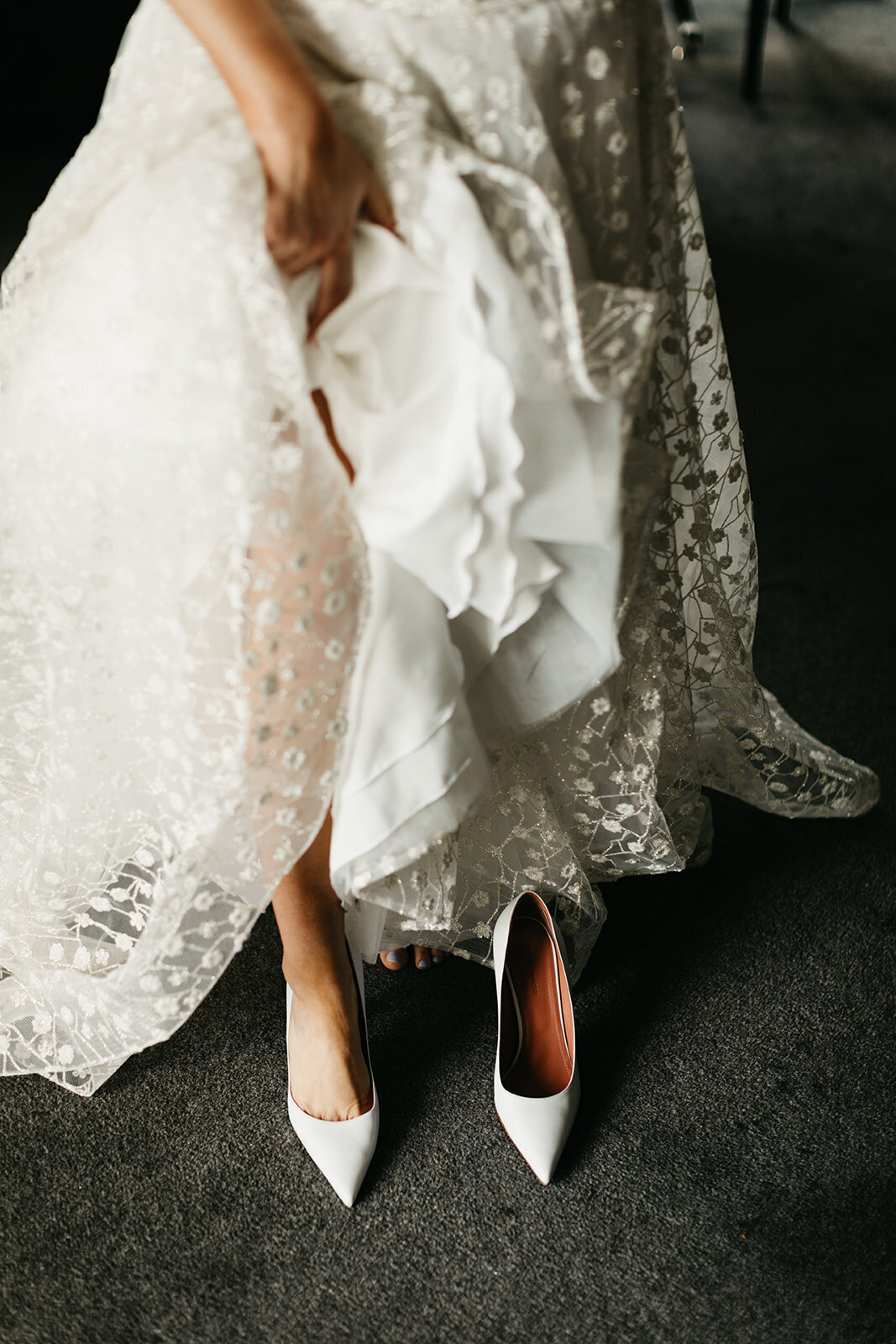 Bride putting on heels