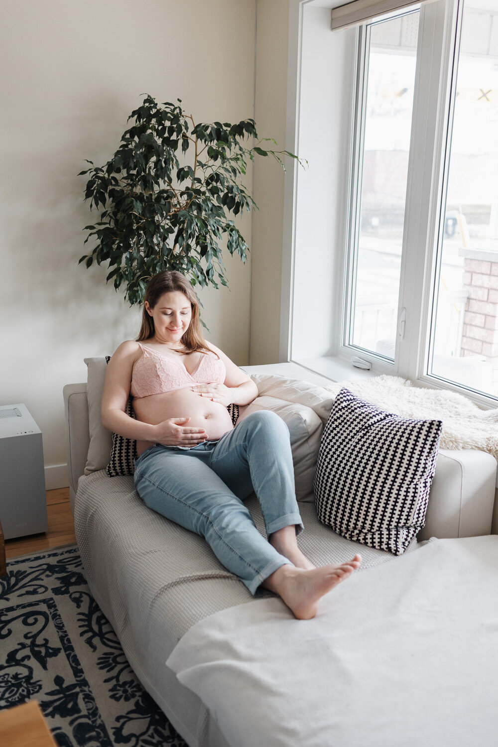 Pregnant woman lounging on couch