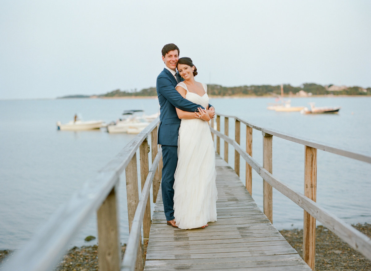 Bride and groom on dock