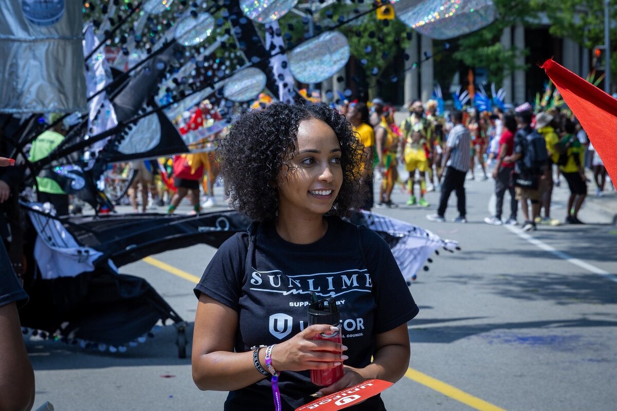 Toronto caribbean carnival parade masqueraders having fun in costume with Sunlime Mas, the number 1 medium size band at Toronto Carnival.