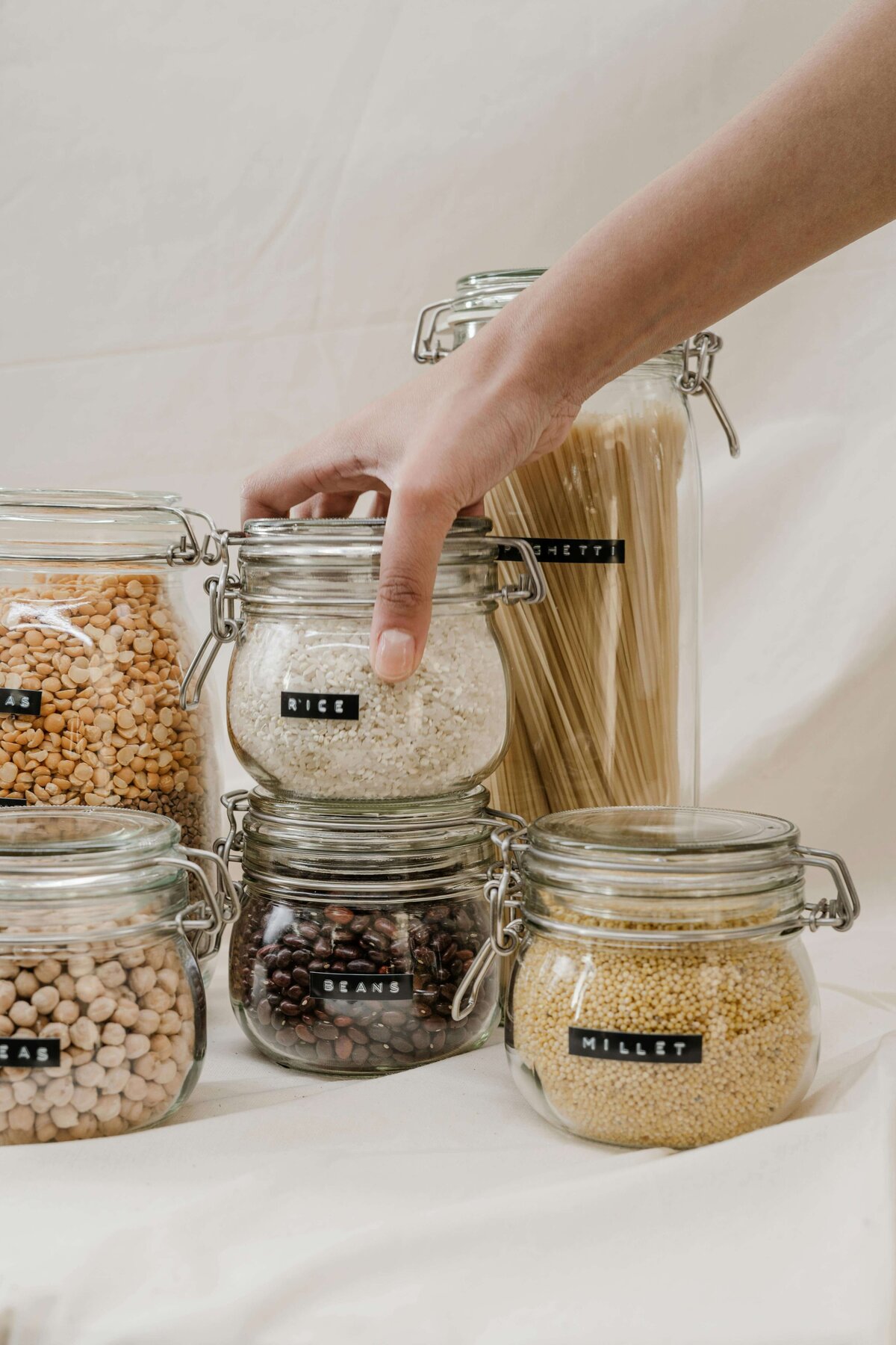 grains and pasta organized into glass jars