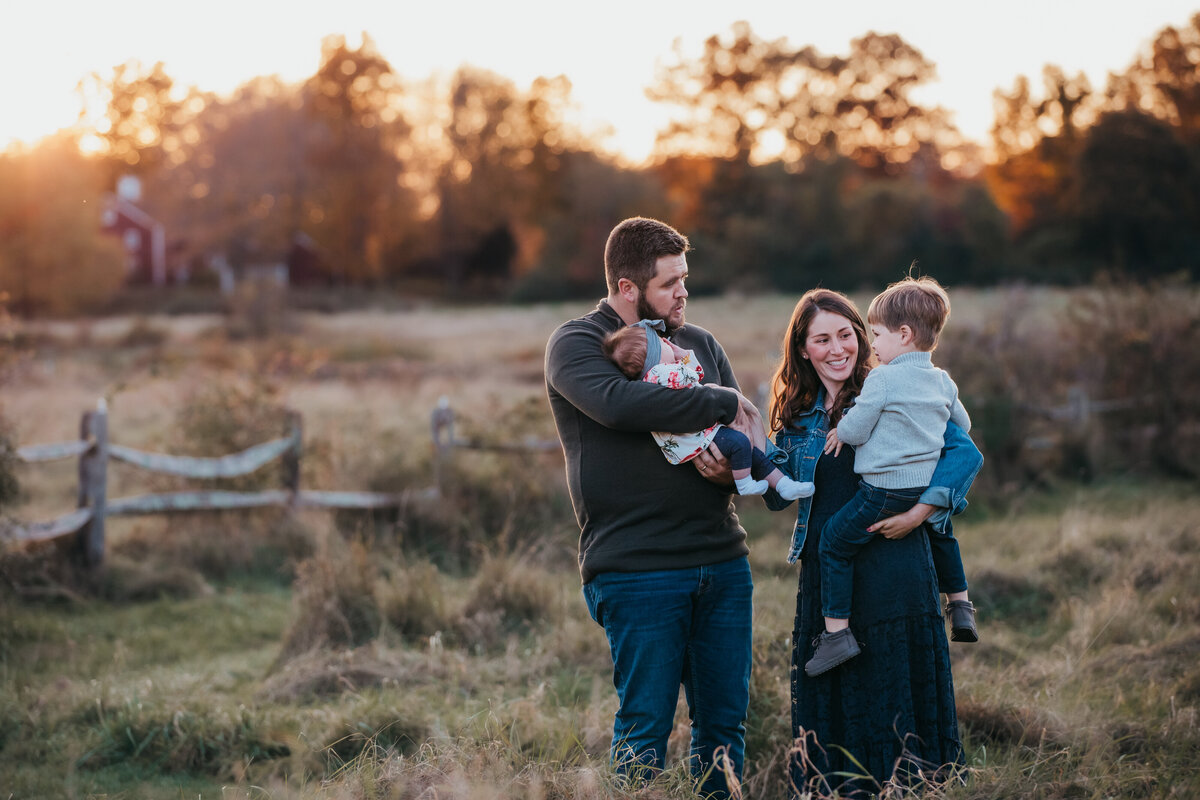 outdoor fall family photoshoot with a newborn baby