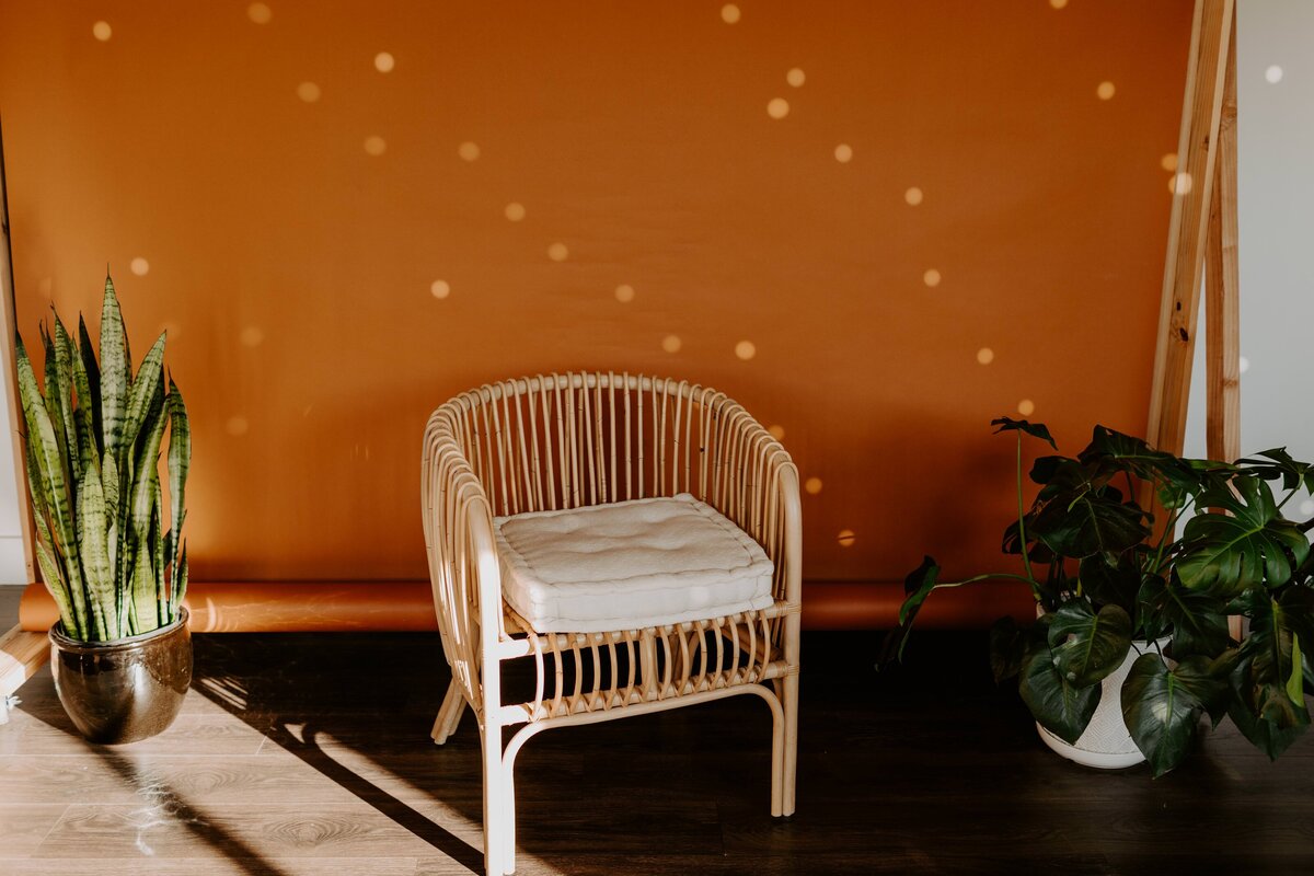 photo studio with an orange backdrop