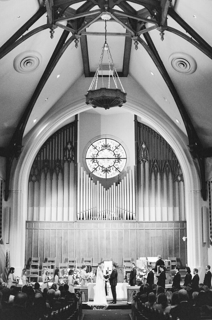 Black and White of Bride and Groom at Church Alter Photo