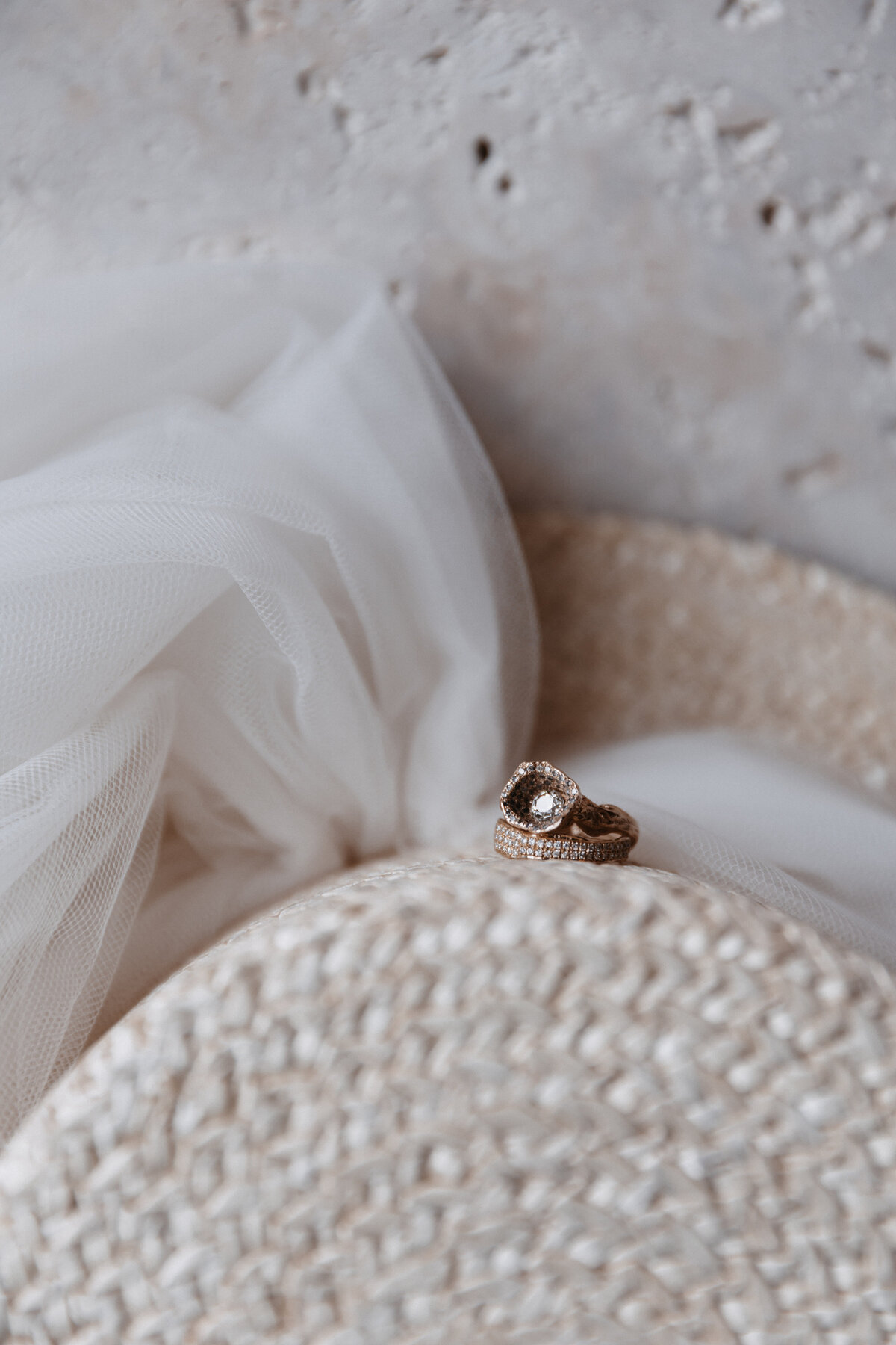 Elopement Photography, unique crystalized wedding ring sitting on top straw hat with white tulle