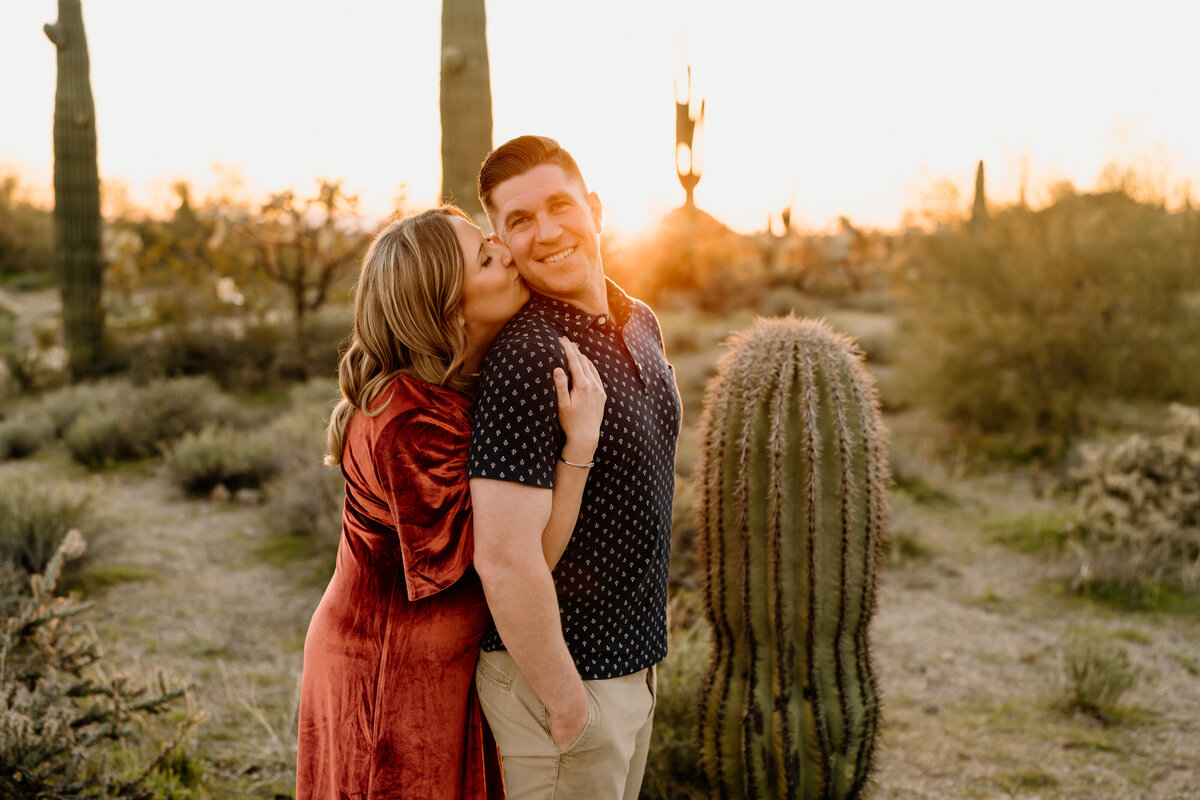 Girl giving man a hug from behind