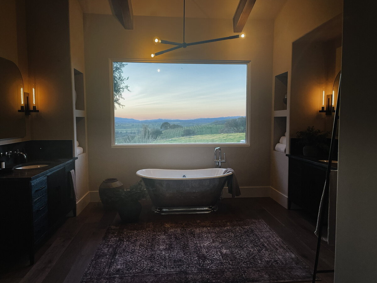 bath tub under window