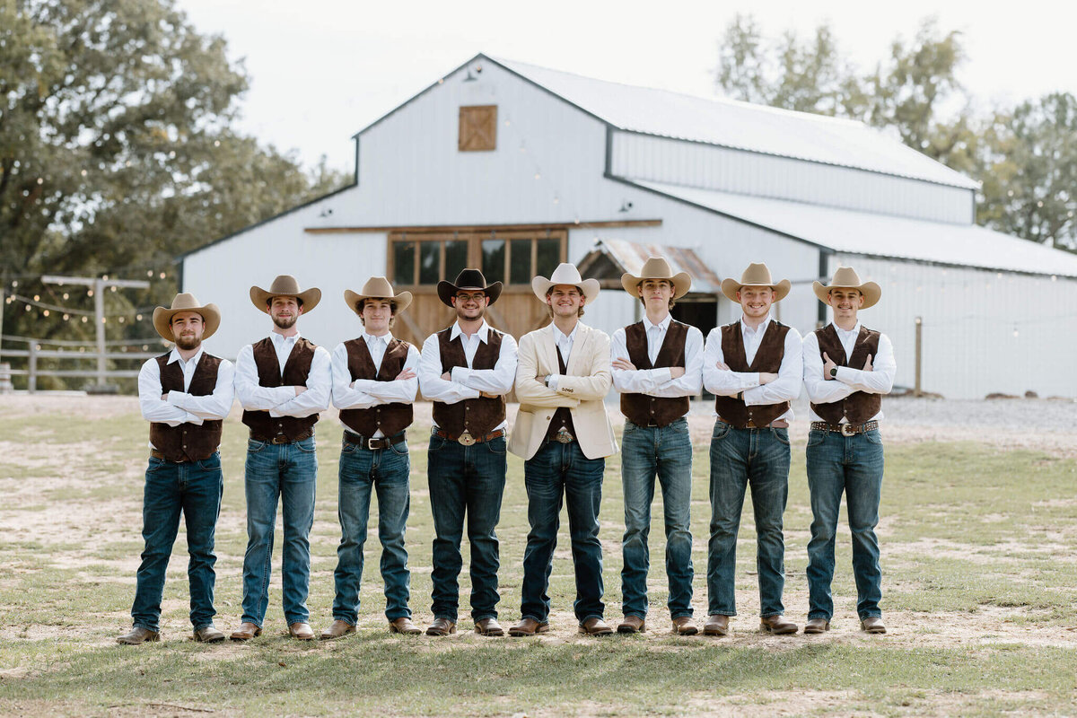 wedding day portrait of groom and groomsmen at Shadow Ranch in boots, jeans, and cowboy hats