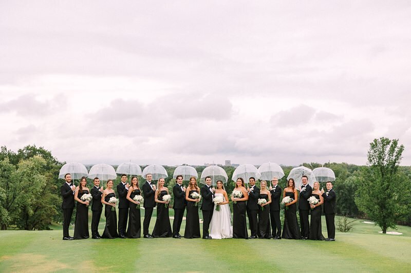 bride-and-groom-rainy-umbrella-evansville-country-club12