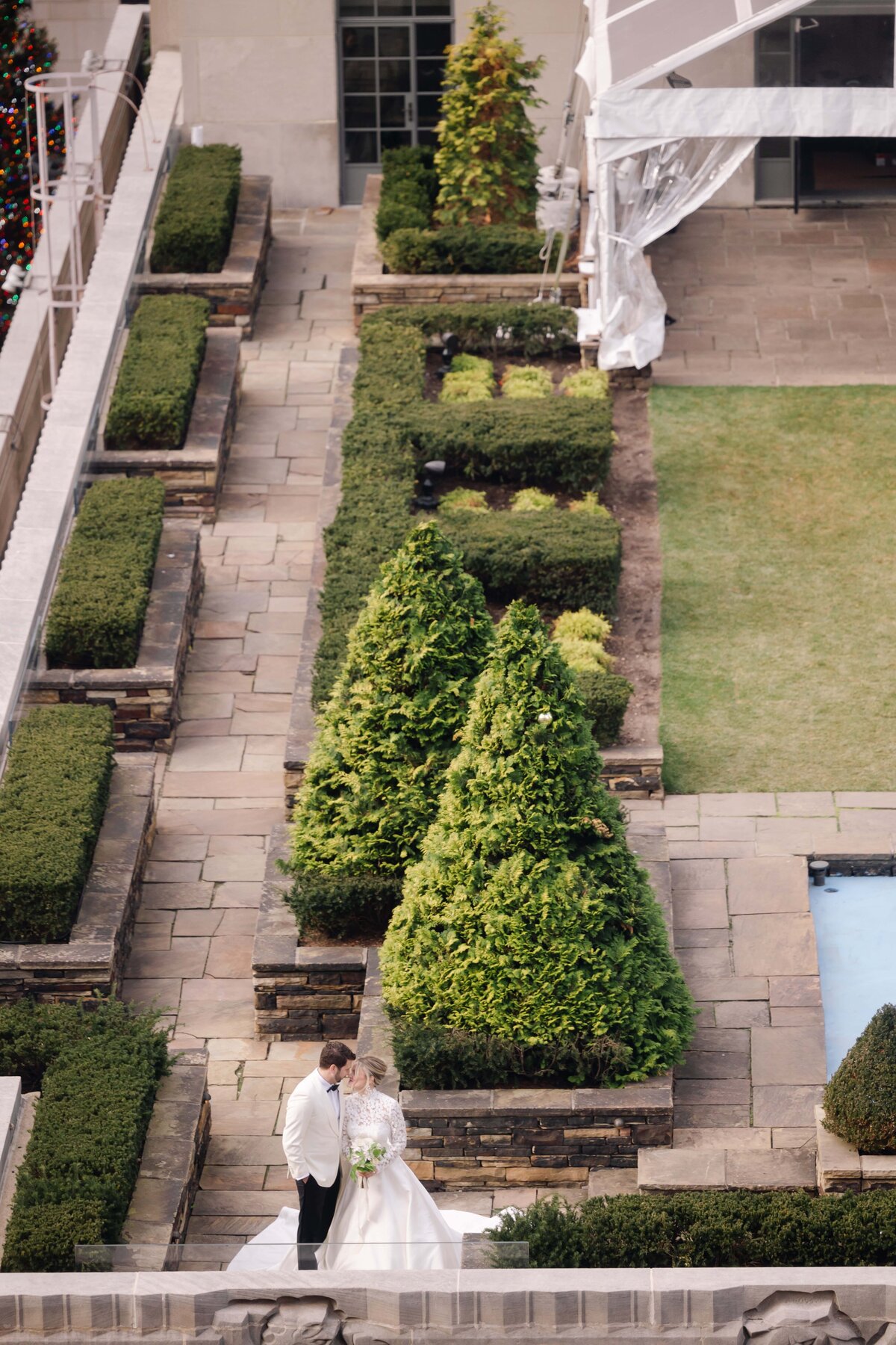 Aerial view of bride and groom on a New York City rooftop