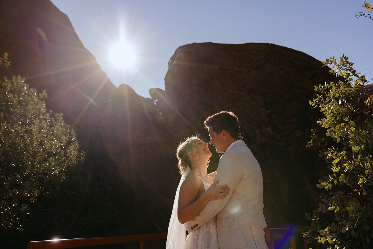 Bride and groom eloping at Uluru