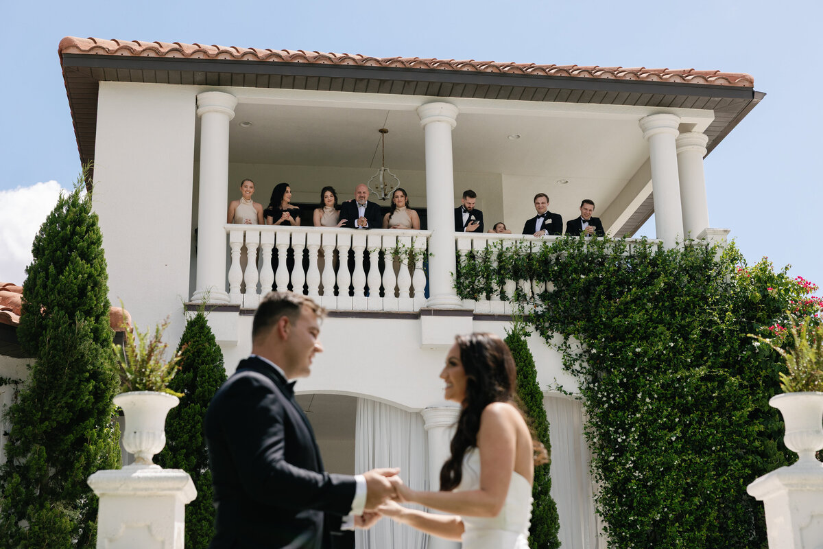 Emotional first look moment between bride and groom at La Casa Toscana