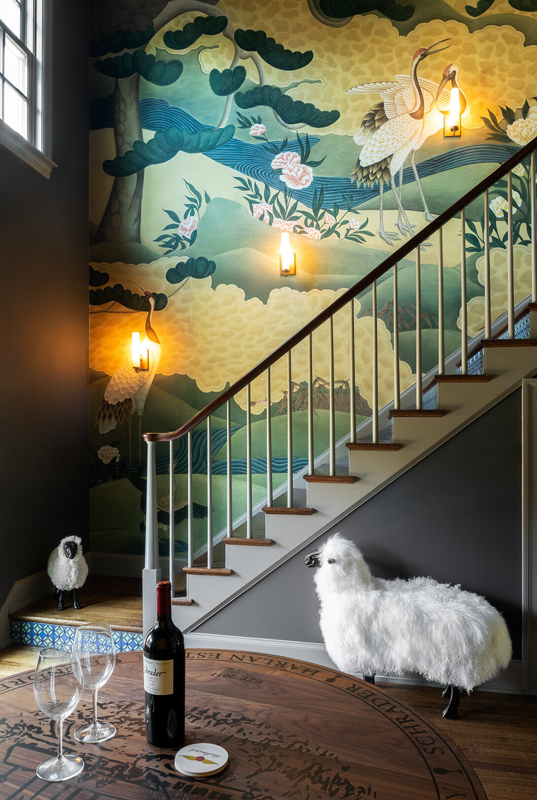 staircase view with nature patterned wall
