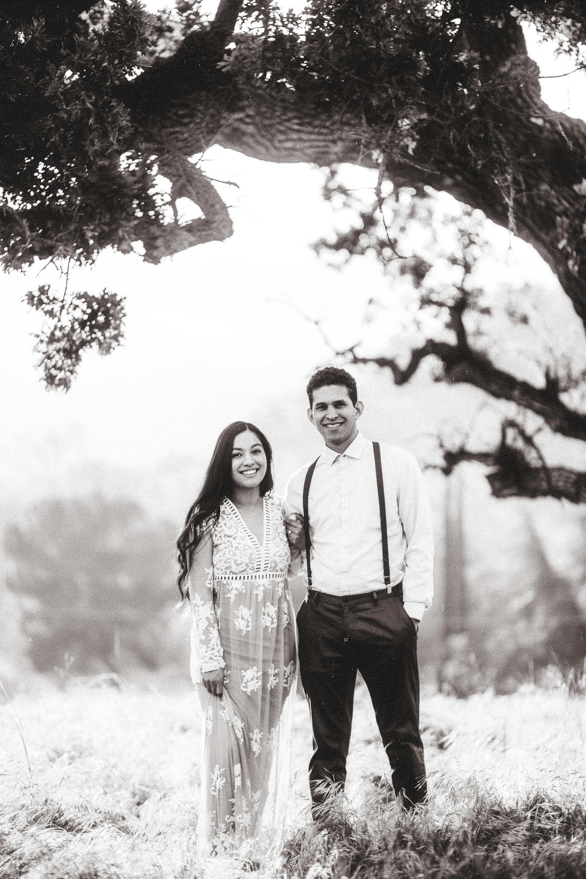 Engagement Photograph Of  Man And Woman in Dress Black And White