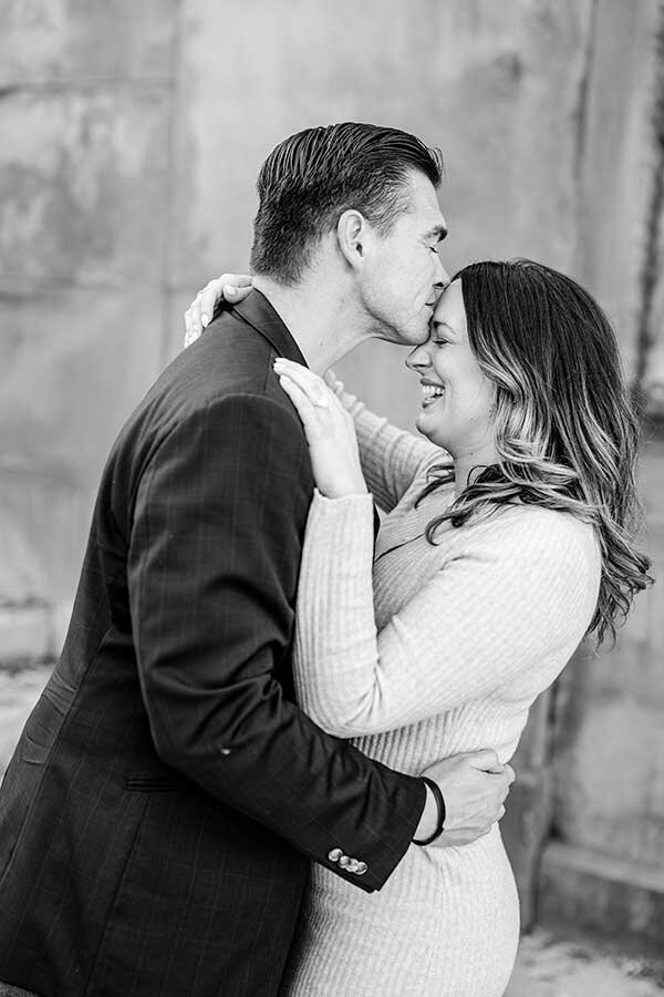 Black and white film photographer NYC man kissing woman