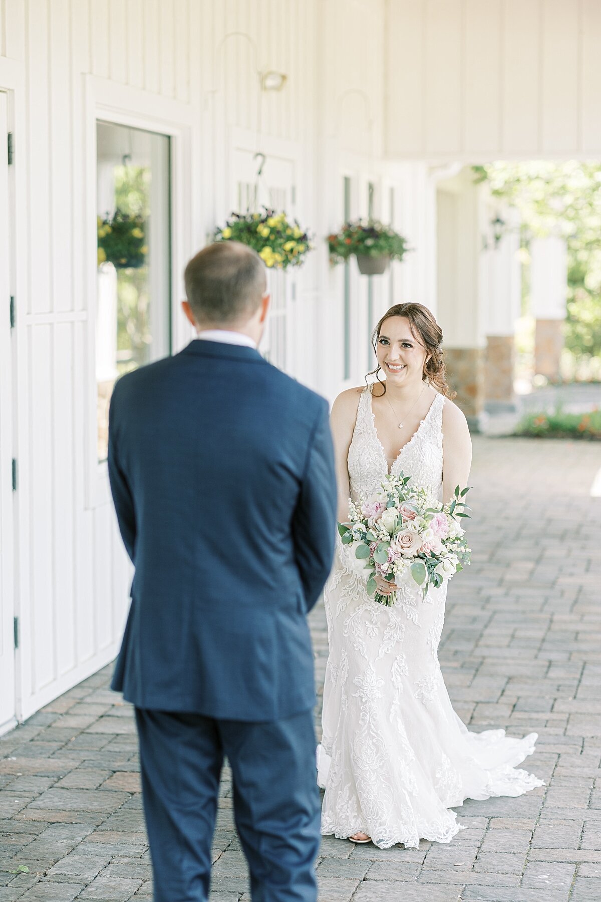 bride and groom having their first look at the Farmhouse NJ