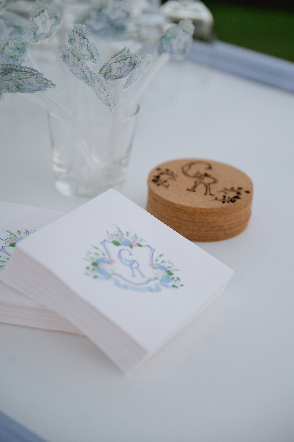 Detailed view of a wedding favor and a guest program at a reception table
