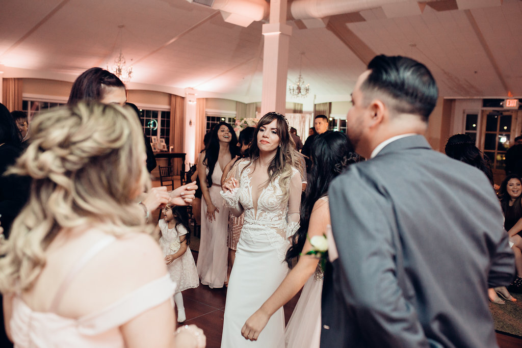Wedding Photograph Of Women In Dresses And Men In Suits Dancing Los Angeles
