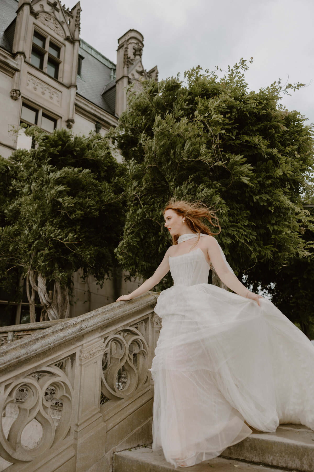 Peaceful bridal portrait framed by the Biltmore’s European-style architecture and a flowy gown.