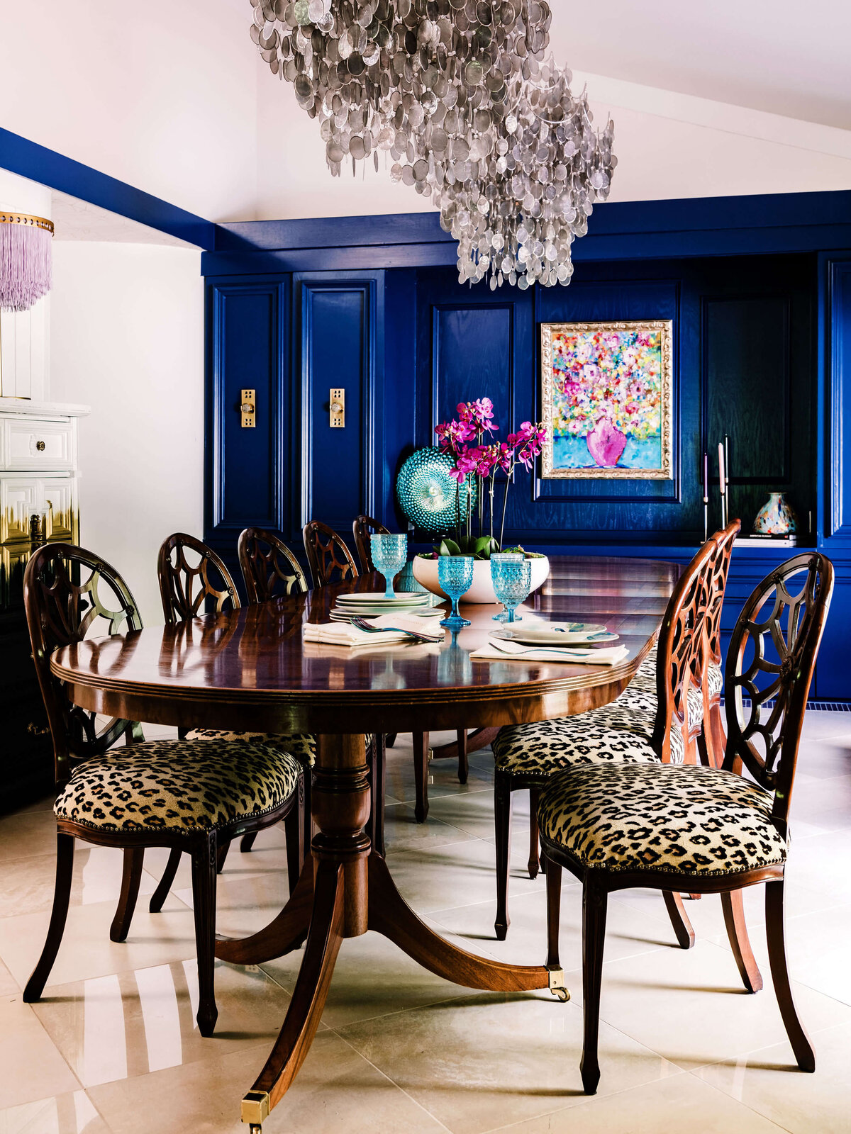 sweet southern home merry maximalism leopard print dining room with blue walls