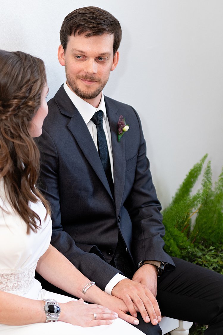 Groom looking lovingly at Bride during self-uniting Quaker wedding ceremony in Pittsburgh, PA