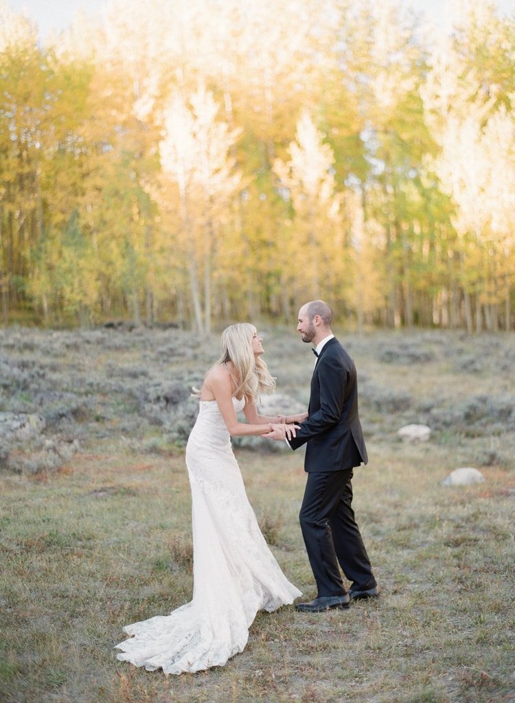 Matthew Moore - fine+art+photo+of+bride+and+groom+playfully+holding+hands+in+aspen+grove