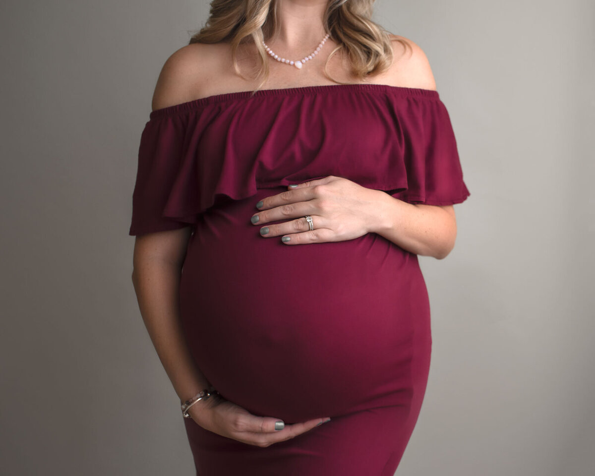 pregnant belly at a studio photoshoot by st. louis maternity photographer