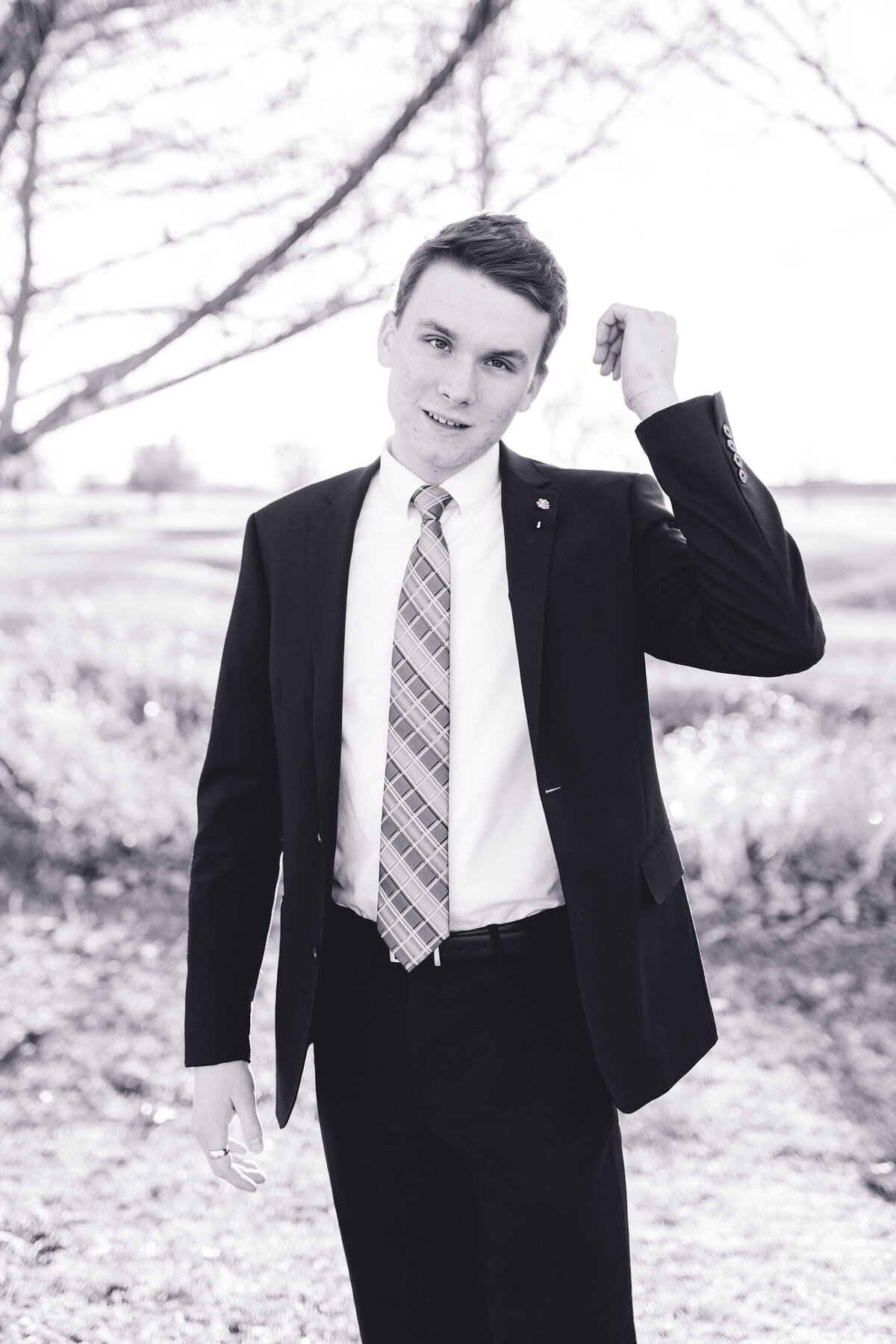 Austin senior boy in suit and tie. Outside in Austin Texas.