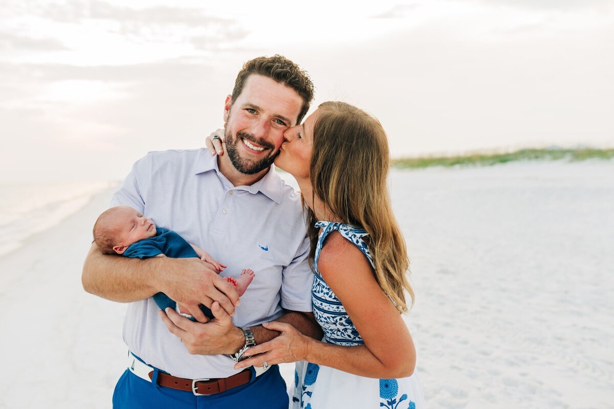 adopted newborn at pensacola beach with mom and dad