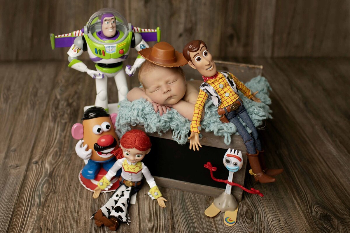 Newborn with Toy Story set up with Chunky Monkey Photography