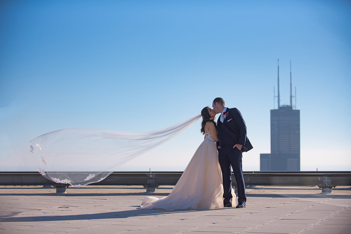 downtown-chicago-wedding-photography-rooftop-veil-shot-bride-groom